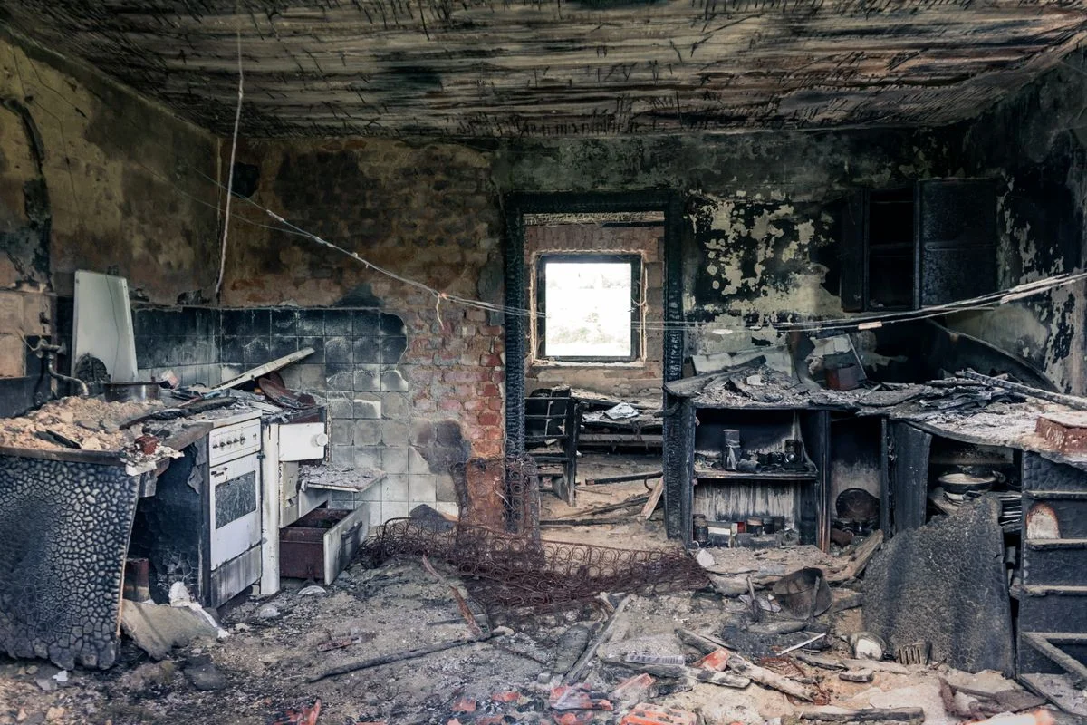 Smoke damage insurance claim California: soot residue on an interior wall requiring professional restoration testing