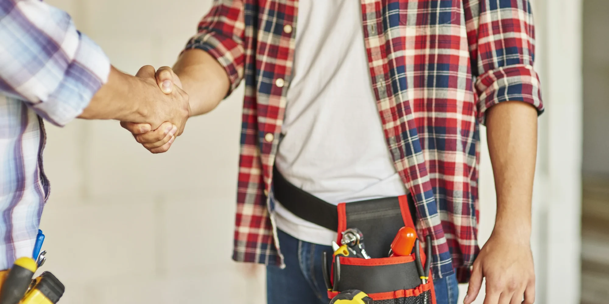 close-up-workers-cooperating-shaking-hands