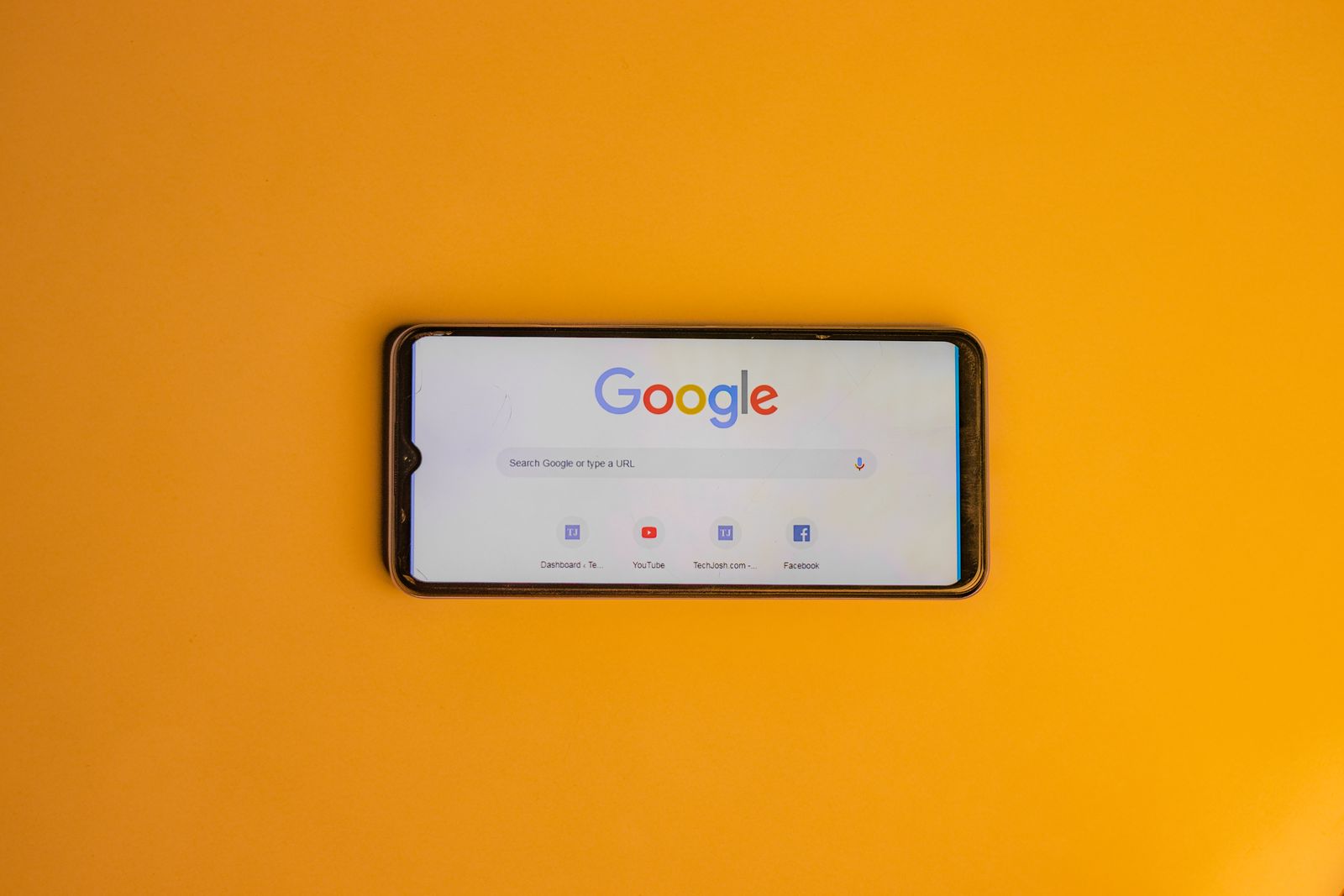 Patient searching Google on a smartphone, where Local Services Ads appear above search ads and the map pack