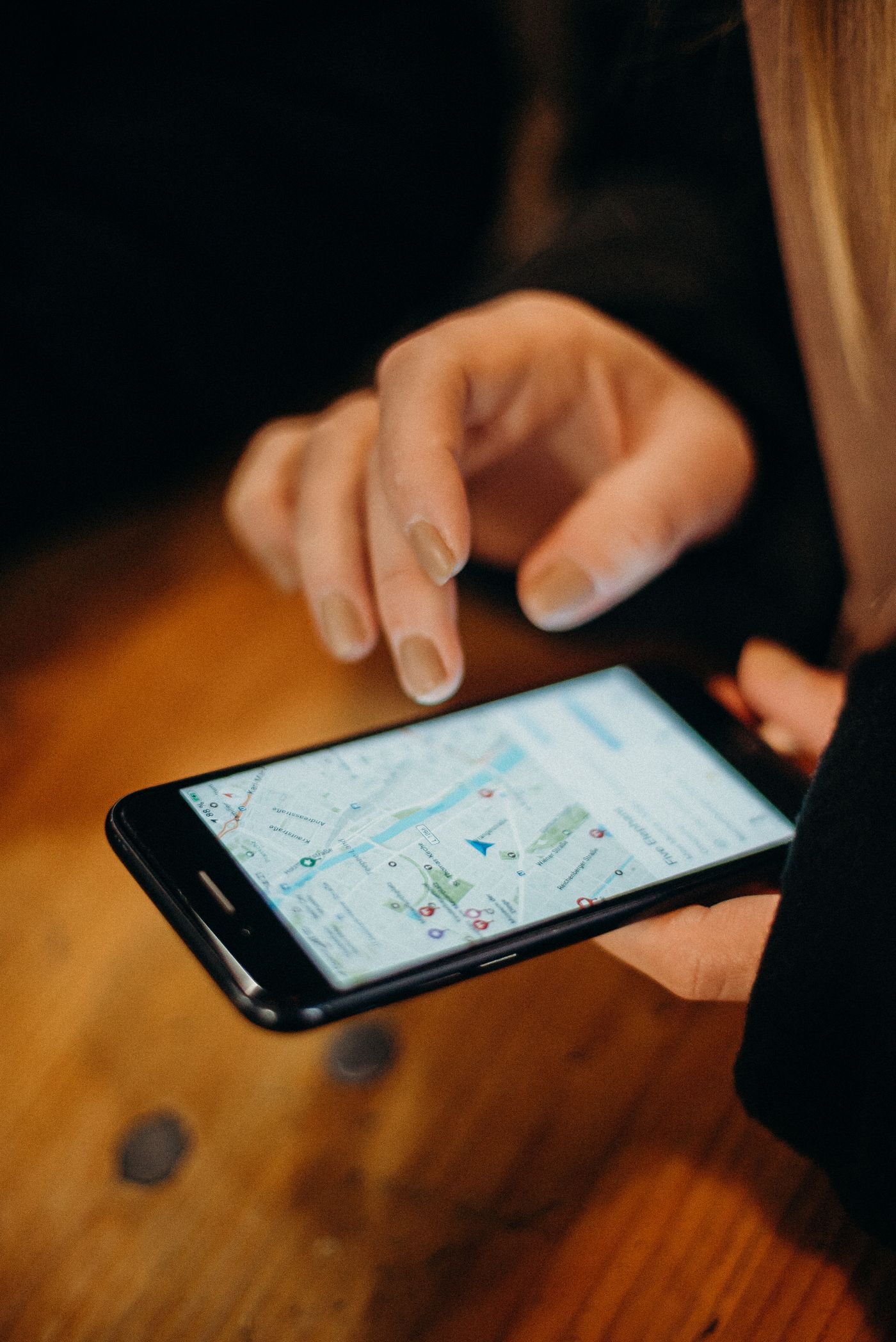 Close-up of a map search on a smartphone, where the local map pack decides which practice a patient calls