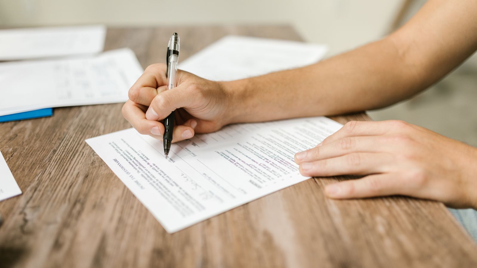 Patient completing an intake form with separate text message consent checkboxes for TCPA compliance