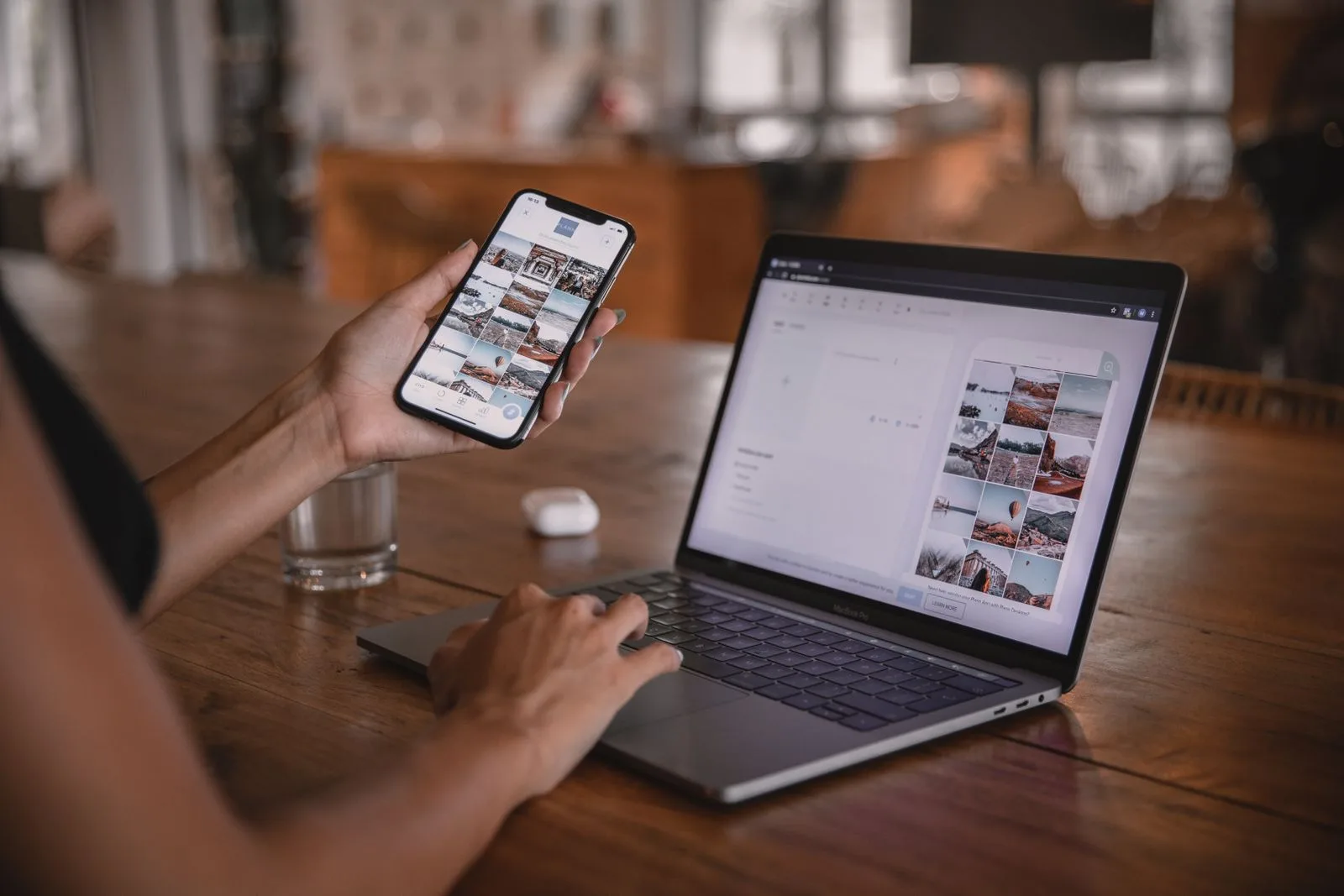 Practice marketing manager reviewing Meta ad campaign content on a phone and laptop