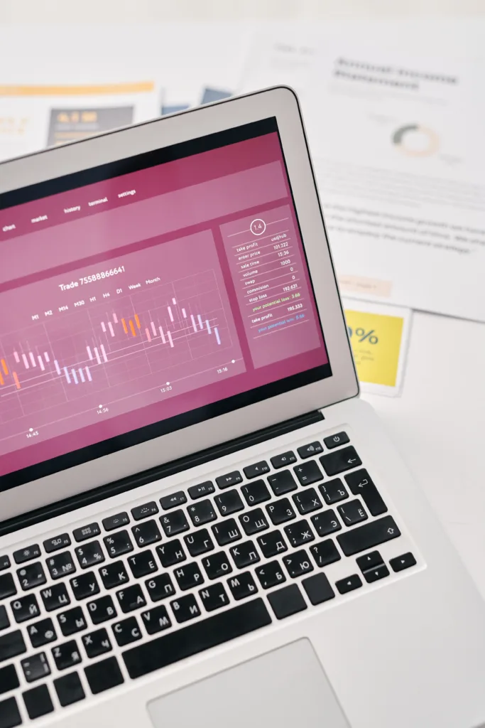 Laptop screen displaying performance graphs and charts, used to review Google Ads campaign data